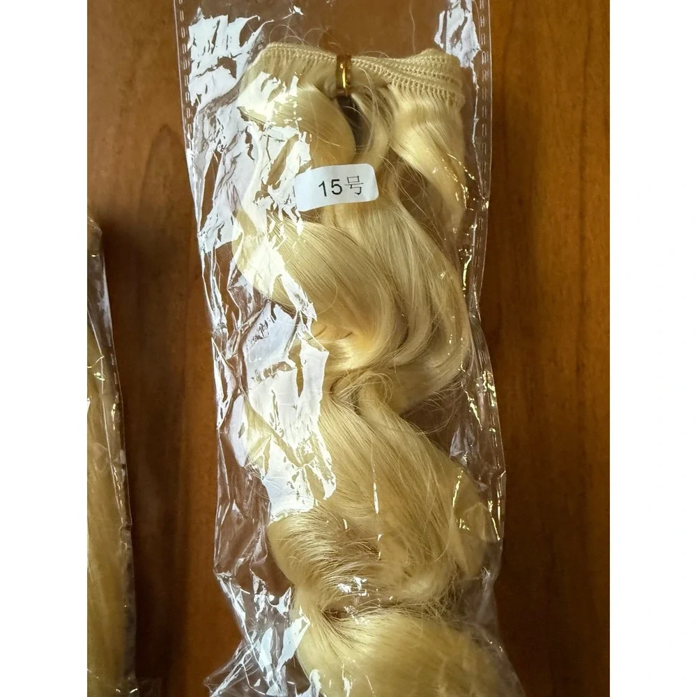 Doll hair wefts. Lot of 13